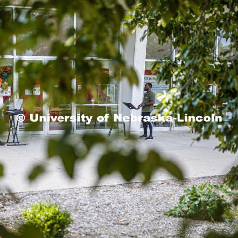 Daniel Ikpeama, doctoral student in music, has a voice lesson with Professor William Shomos outside of Kimball Recital Hall. August 28, 2020. Photo by Craig Chandler / University Communication.