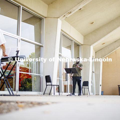 Daniel Ikpeama, doctoral student in music, has a voice lesson with Professor William Shomos outside of Kimball Recital Hall. August 28, 2020. Photo by Craig Chandler / University Communication.