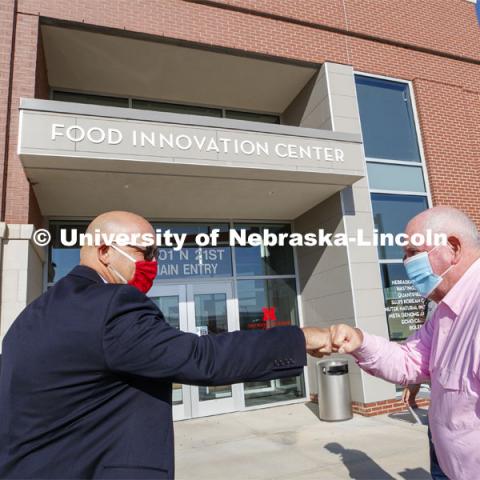 UNL Harlan Vice Chancellor for IANR and NU Vice President Mike Boehm, left, fist bumps United States Secretary of Agriculture Sonny Perdue at Purdue's arrival for the Nebraska Agricultural Innovation Panel. September 4, 2020. Photo by Craig Chandler / University Communication.