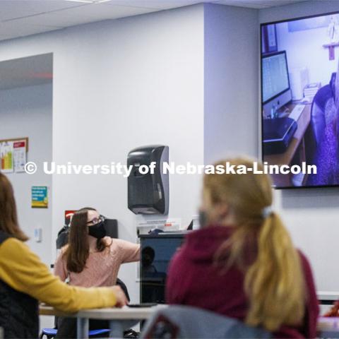 Rose Kottwitz, an Honor's Program learning assistant, adjusts the volume on lecturer Pascha Sotolongo Stevenson for the class in Knoll and for those zooming in. The class is UHON 189H: Writing the Contemporary Fairy Tale. September 10, 2020. Photo by Craig Chandler / University Communication.