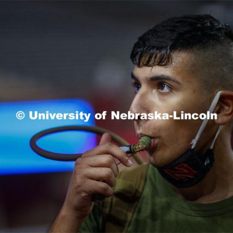 Roman Montes takes a drink from his Camelbak water pack. UNL ROTC cadets and Lincoln first responders run the steps of Memorial Stadium to honor those who died on September 11. Each cadet ran more than 2,000 steps. September 11, 2020. Photo by Craig Chandler / University Communication.