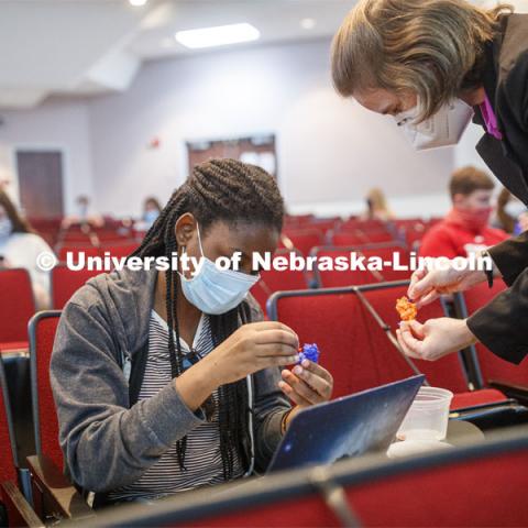 Rebecca Roston (right), associate professor of biochemistry, explains the activity of an enzyme using a 3D-printed model during Biochemistry I: Structure and Metabolism (BIOC 431). Professors Roston and Karin van Dijk are using models of six biomolecules to help students visualize their structures and better understand their functions. September 14, 2020. Photo by Craig Chandler / University Communication.