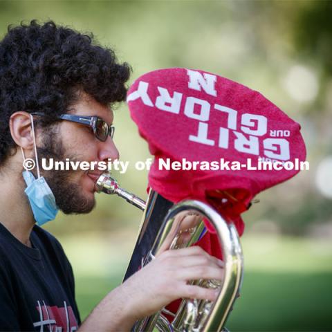 Max Jabir, freshman from Chicago, improvised a gritty choice for the glory of his music as he practices with two other musicians in the Sheldon Gardens. September 22, 2020. Photo by Craig Chandler / University Communication.