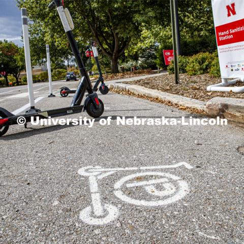 Scooters park in a designated area south of Love Library. September 28, 2020. Photo by Craig Chandler / University Communication.