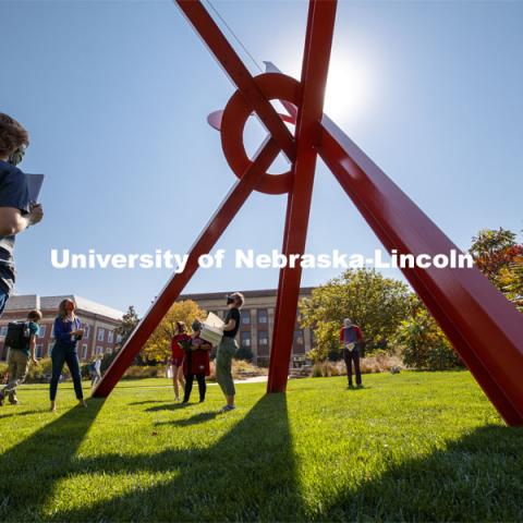 Professor, Anna Henson talks with her students as the Principles of Interactivity class takes an art walk around the Old Glory sculpture. Their impressions are to help them with an augmented reality project. City Campus. October 7, 2020. Photo by Craig Chandler / University Communication.