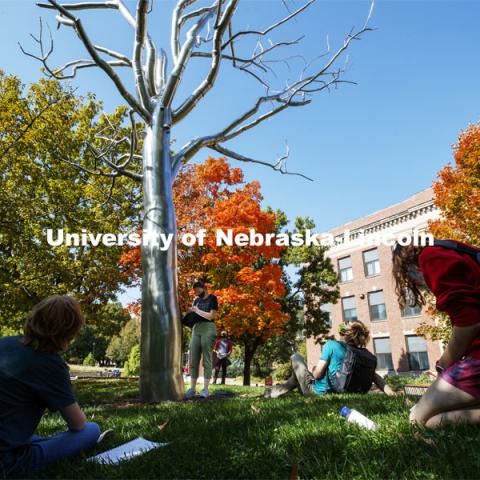 Students in the Principles of Interactivity class surround Breach, a sculpture by Roxy Paine, during an art walk with Professor Ann Henson. Their impressions are to help them with an augmented reality project. City Campus. October 7, 2020. Photo by Craig Chandler / University Communication.