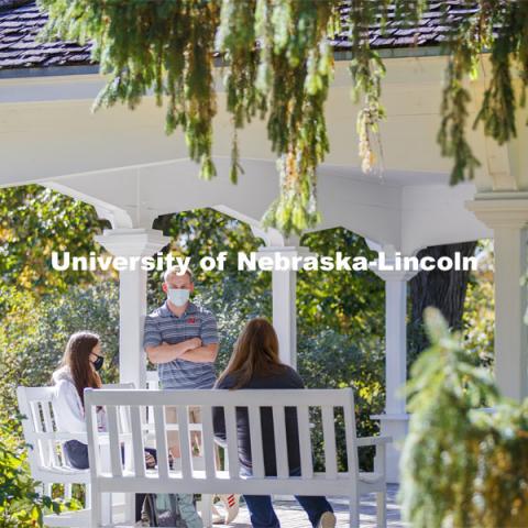 Students enjoy the afternoon on Perin Porch on east campus. East Campus photo shoot. October 13, 2020.  Photo by Craig Chandler / University Communication