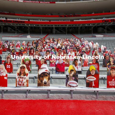 Cardboard cutouts of fans fill the stands in Memorial Stadium. Cornhusker Marching Band, Cheer Squad and Homecoming Royalty met in the empty Memorial Stadium to record performances that will air during Husker football games on the Big 10 Network during the upcoming season. October 18, 2020. Photo by Craig Chandler / University Communication.