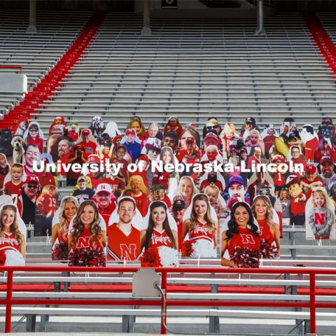 Cardboard cutouts of fans fill the stands in Memorial Stadium. Cornhusker Marching Band, Cheer Squad and Homecoming Royalty met in the empty Memorial Stadium to record performances that will air during Husker football games on the Big 10 Network during the upcoming season. October 18, 2020. Photo by Craig Chandler / University Communication.