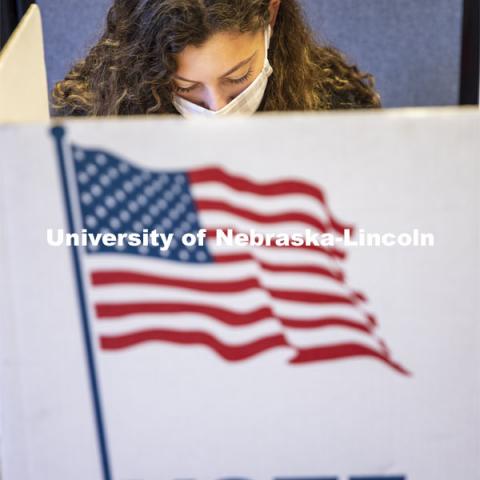 Grace Carey, a freshman from Bellevue, Nebraska, votes in her first election. Voting in the Nebraska Union for the 2020 Presidential Election. November 3, 2020. Photo by Craig Chandler / University Communication.