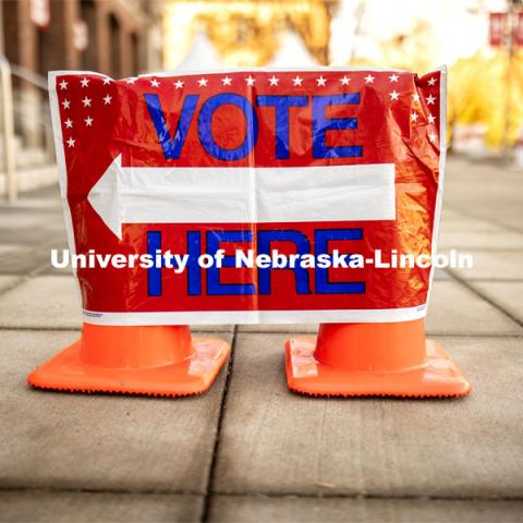 A "Vote Here" sign directs people into the Nebraska Union. Voting in the Nebraska Union for the 2020 Presidential Election. November 3, 2020. Photo by Craig Chandler / University Communication.