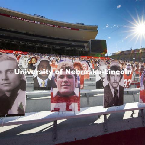 Nearly 100 Husker Academic All-Americans line the Memorial Stadium bleachers where the Cornhusker Marching Band normally plays (section 10) in the East Stadium. The university leads the nation with 340 student-athletes having earned Academic All-American status. More than 6,000 corrugated plastic cutouts fill the lower level of east stadium, the tunnel walk, and part of north stadium to remind the Huskers who has the Greatest Fans in College Football. November 12, 2020. Photo by Craig Chandler / University Communication.