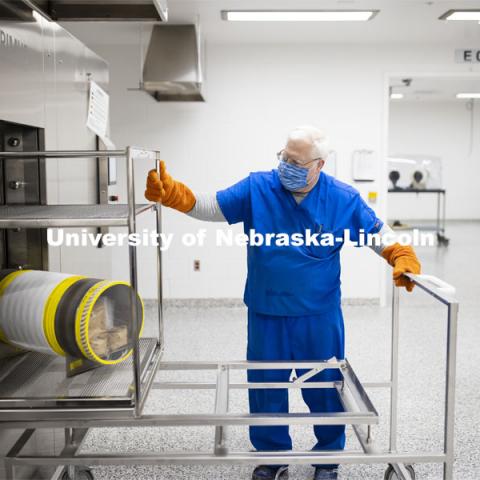 Robert Schmaltz, manager of the Gnotobiotic Mouse Facility, removes a sterilized supply cylinder from an autoclave. Photos of the new Gnotobiotic Mouse Facility - Nebraska Food for Health Center. November 19, 2020. Photo by Craig Chandler / University Communication.