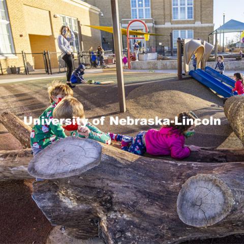 Children at the University of Nebraska-Lincoln Children's Center spent time on pajama day climbing on actual trees placed on the playground. December 7, 2020. Photo by Craig Chandler / University Communication.