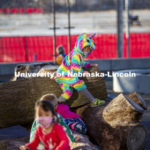 Children at the University of Nebraska-Lincoln Children's Center spent time on pajama day climbing on actual trees placed on the playground. December 7, 2020. Photo by Craig Chandler / University Communication.