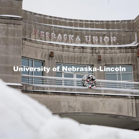 The Nebraska Union is ready for christmas with it's wreath and bricks covered in snow. Snow on UNL City Campus. December 12, 2020. Photo by Jordan Opp for University Communication.