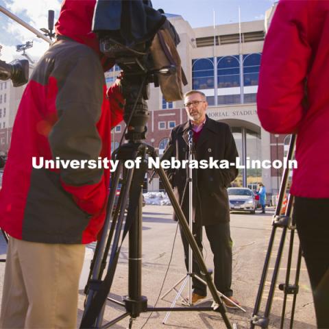 Chancellor Ronnie Green talks with media and takes his COVID-19 saliva test Tuesday afternoon at the East Stadium loop site.  January 19, 2021. Photo by Craig Chandler / University Communication