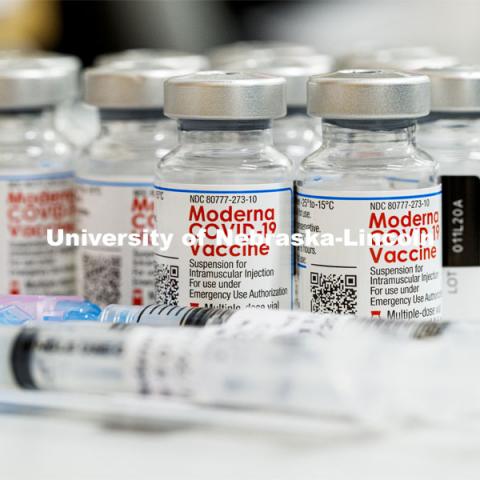 Syringes and vials of Moderna COVID-19 Vaccine. University Health Center and UNMC College of Nursing students, staff, and faculty receive their first COVID vaccine. January 29, 2021. Photo by Craig Chandler / University Communication.