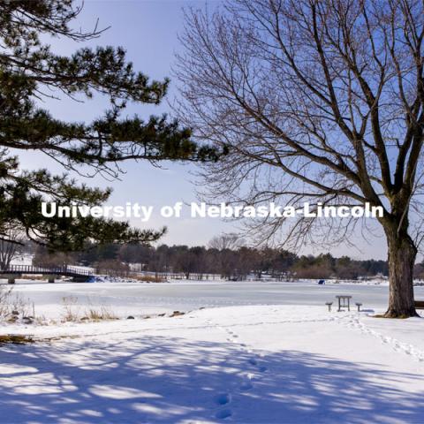 Footsteps in the snow at Holmes Lake in the winter. February 1, 2021. Photo by Craig Chandler / University Communication.