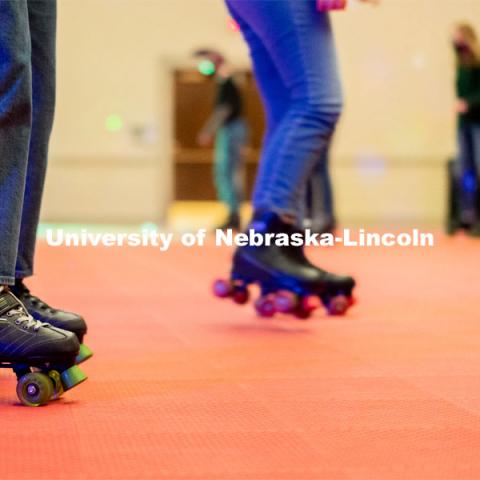 Students begin skating in a circle during the Club 80 Roller Skating Event in the Nebraska Union Ballroom on Friday, February 19, 2021, in Lincoln, Nebraska. Photo by Jordan Opp for University Communication.