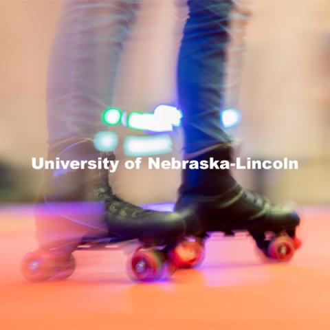 A student skates around in a circle before more students enter the skating area during the Club 80 Roller Skating Event in the Nebraska Union Ballroom on Friday, February 19, 2021, in Lincoln, Nebraska. Photo by Jordan Opp for University Communication.