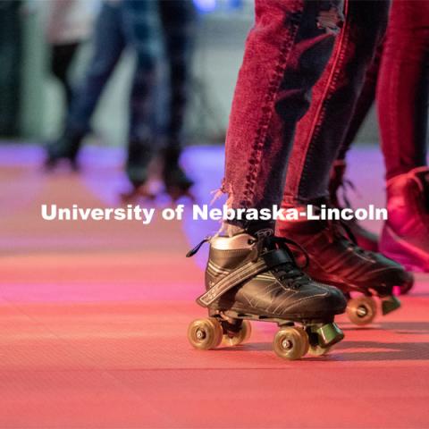 Students skate in a circle during the Club 80 Roller Skating Event in the Nebraska Union Ballroom on Friday, February 19, 2021, in Lincoln, Nebraska. Photo by Jordan Opp for University Communication.