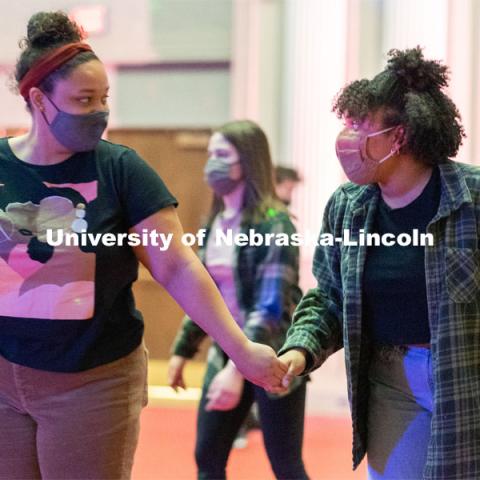 Students hold hands as they skate during the Club 80 Roller Skating Event in the Nebraska Union Ballroom on Friday, February 19, 2021, in Lincoln, Nebraska. Photo by Jordan Opp for University Communication.