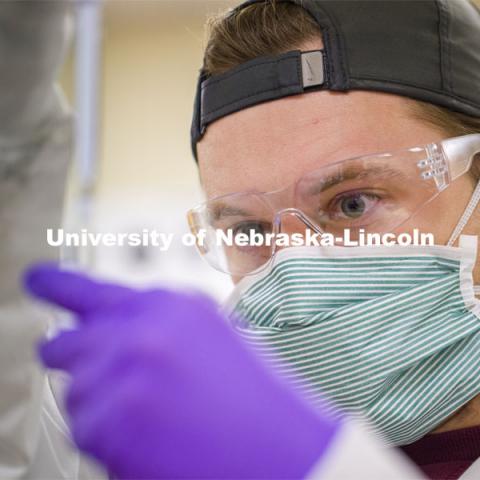 Evan Brende pipettes a DNA sample. Forensic Science 485 is the capstone for the seniors. The CSI option students work a mock crime scene while the biochemistry option students process the samples. The class concludes with a mock trial. March 2, 2021. Photo by Craig Chandler / University Communication.