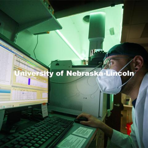 Zach Shomo looks over the data from a fatty acid. He is looking at the read-out of a detector after chromatography. Chromatography separates molecules by their physical properties. The detector sends a signal whenever it detects something. The result is a series of bumps representing separated groups of molecules. To tell what they are, you either need to run standards or further tests. In this case. Photo shoot in Rebecca Roston’s biochemistry lab in Beadle Hall. March 2, 2021. Photo by Craig Chandler / University Communication.