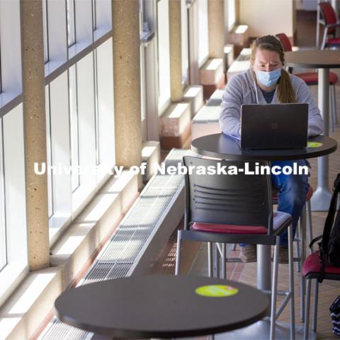 Megan Eichhoff participates in an online class in the open lobby of the Animal Science Complex on East Campus. March 9, 2021. Photo by Craig Chandler / University Communication.