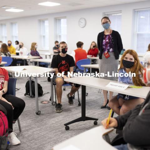 Maria Benes, faculty affiliate with the Honors Program and course instructor, discusses the day’s topics with the in-class and remote students in UHON 102H: The Science of You. Students interact with each other as they discuss a topic. Almost 550 students enrolled, across 18 sections, taught by 7 instructors with the aid of 20 upper-class learning assistants, are taking the required first-year course for honor students. March 16, 2021. Photo by Craig Chandler / University Communication.