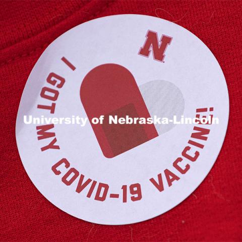 "I GOT MY COVID-19 VACCINE!" sticker. Vaccine clinic in the Coliseum with a free food and goodies tent outside. April 20, 2021. Photo by Craig Chandler / University Communication.  