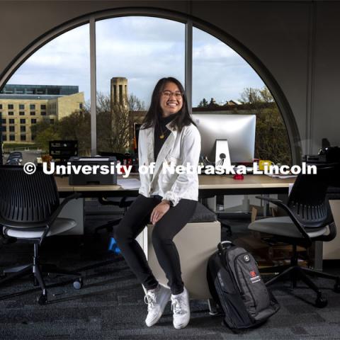 Clarice Ann Santos, a senior economics and sociology major, is pictured in the community work room in the CB3 office for an ASEM recruitment feature story. April 21, 2021. Photo by Craig Chandler / University Communication.  