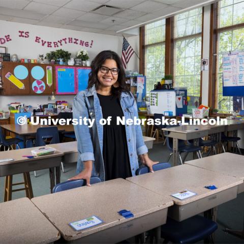 Sydney Trench, an elementary education major, poses in an elementary classroom for an ASEM recruitment story. April 23, 2021. Photo by Craig Chandler / University Communication.  