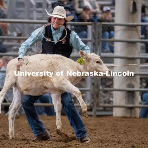Nebraska’s Grant Lindsley competes in the tie down roping event at the Nebraska Cornhusker College Rodeo at the Lancaster Event Center. April 24, 2021. Photo by Jordan Opp for University Communications.