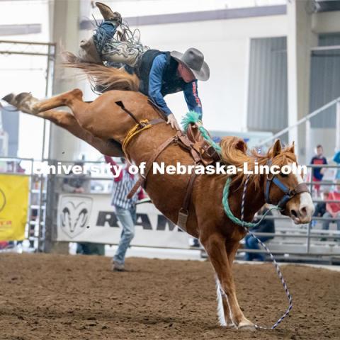 Nebraska’s Sam Florell competes in the saddle bronc riding event at the Nebraska Cornhusker College Rodeo at the Lancaster Event Center. April 24, 2021. Photo by Jordan Opp for University Communications.