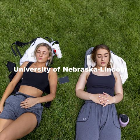 Emily Boyle, right, and Emily Maul, both from Lincoln, enjoy some dead week down time in the greenspace north of the Nebraska Union. City Campus. April 27, 2021. Photo by Craig Chandler / University Communication.  
