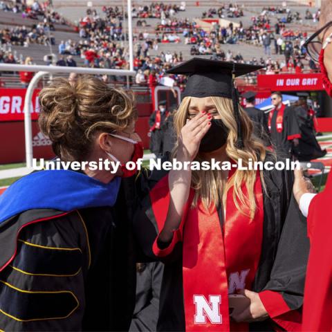 Julia Boogaard with Mike Boehm, Tiffany Heng-Moss and Ronnie Green. UNL Commencement in Memorial Stadium. May 8, 2021. Photo by Craig Chandler / University Communication.