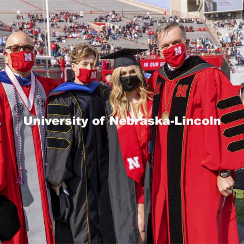 Julia Boogaard with Mike Boehm, Tiffany Heng-Moss and Ronnie Green. UNL Commencement in Memorial Stadium. May 8, 2021. Photo by Craig Chandler / University Communication.