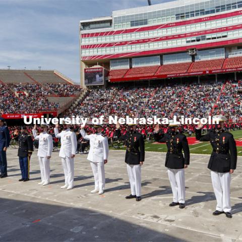 Air Force, Navy Marine and Army ROTC cadets recite the oath of enlistment at the beginning of the morning commencement. The cadets then changed into regalia to graduate with their colleges. The university conferred a record 3,594 degrees during the May commencement ceremonies. UNL Commencement in Memorial Stadium. May 8, 2021. Photo by Craig Chandler / University Communication.