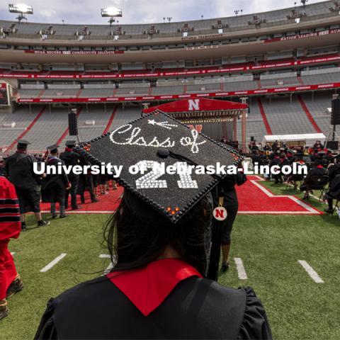 Delaney Zimmerman walks towards the stage and her College of Business diploma. UNL Commencement in Memorial Stadium. May 8, 2021. Photo by Craig Chandler / University Communication.