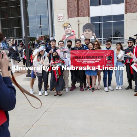 Frederick Chua poses with family and friends after the morning commencement. UNL Commencement in Memorial Stadium. May 8, 2021. Photo by Craig Chandler / University Communication.