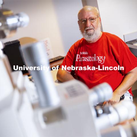 Nebraska's Karl Reinhard in his lab on East Campus. By analyzing the fossilized gut contents of a U.S. Marine killed in the Korean War, Reinhard and his colleagues have determined what the Marine ate to survive in the 12 days following a siege of the Chosin Reservoir by 120,000 Chinese troops. The analysis indicated that the Marine subsisted on so-called famine foods — eating mostly stems, roots and leaves from flowering plants. The case study helps illustrate the dire realities of trying to consume adequate nutrition after being separated from supply lines by overbearing enemy forces. May 12, 2021. Photo by Craig Chandler / University Communication.