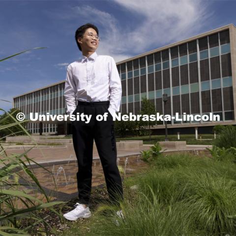 Zhaozhou Dai, a senior journalism major, poses outside of Andersen Hall for an ASEM recruiting story. May 26, 2021. Photo by Craig Chandler / University Communication.  