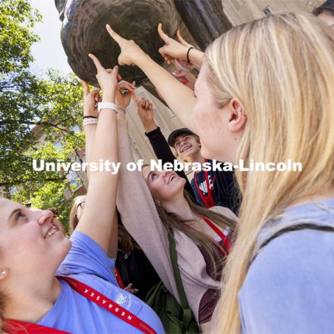 A group of students touch Archie’s foot for good luck as each group made photos for social media. New Student Enrollment began this week and will continue through July 9. June 2, 2021. Photo by Craig Chandler / University Communication.