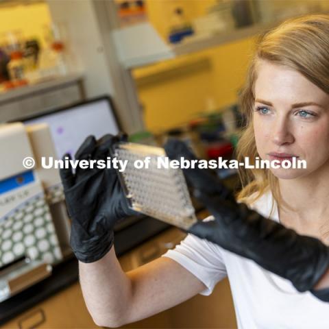 Graduate student Kari Heck places samples into a flow Cytometry analyzer in the Morrison Center for Virology. Nebraska Center for Biotechnology. June 25, 2021. Photo by Craig Chandler / University Communication.