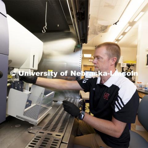 Flow Cytometry Service Center Manager, Dirk Anderson works with samples in a flow Cytometry sorter in the Morrison Center for Virology. Nebraska Center for Biotechnology. June 25, 2021. Photo by Craig Chandler / University Communication.