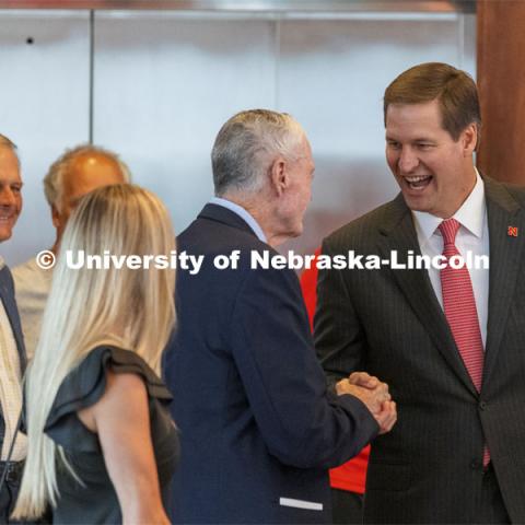 New Nebraska Athletic Director Trev Alberts greets his former coach Tom Osborne as Alberts arrives to the press conference. Alberts returns to his alma mater after spending the last 12 years at UNO. July 14 2021. Photo by Craig Chandler / University Communication.