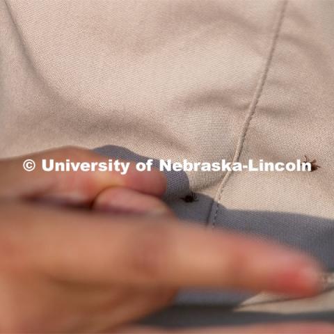 Tick check. Reller Prairie Field Station south of Martell, Nebraska. August 3, 2021. Photo by Craig Chandler / University Communication.