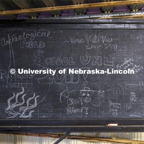 A blackboard is decorated by the last class held in 2011 at Reller, before the rehabilitation began. Reller Prairie Field Station south of Martell, Nebraska. August 3, 2021. Photo by Craig Chandler / University Communication.